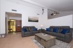 The living area has plenty of seating to relax and enjoy time away with friends and family